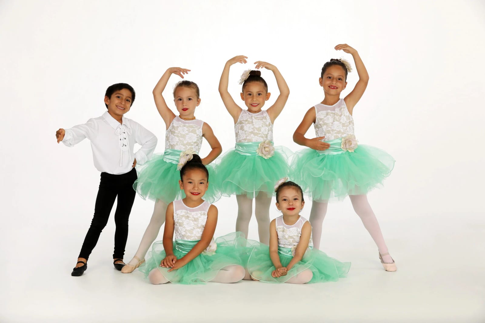 Our pre-ballet dancers in mint green tutus on the white studio backdrop.