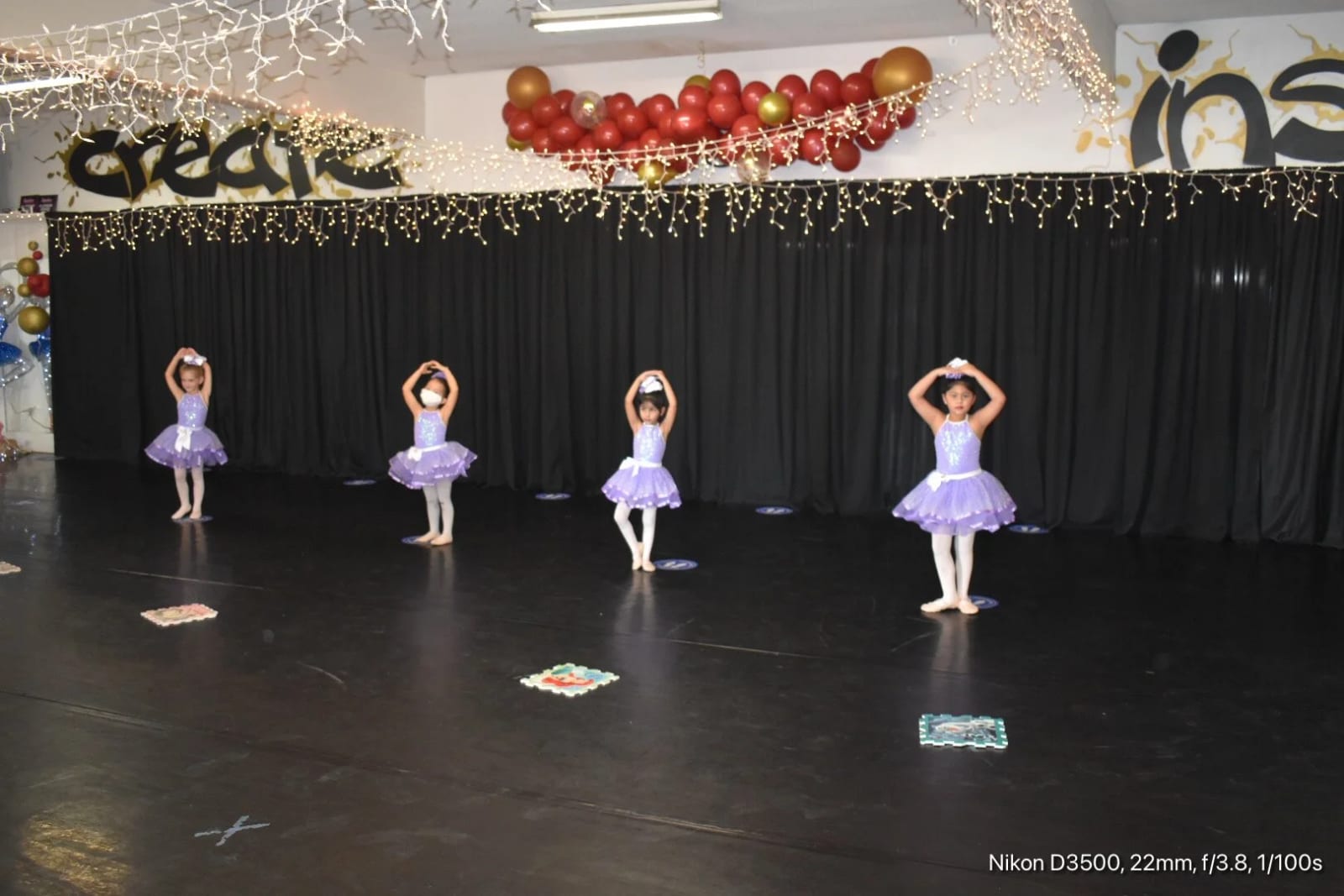 Four of our youngest ballerinas in lavender tutus on the showcase stage.